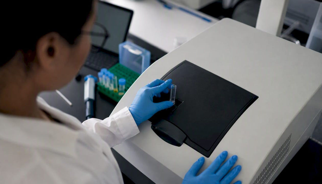 Scientist pipetting peptide sample for UV measurement