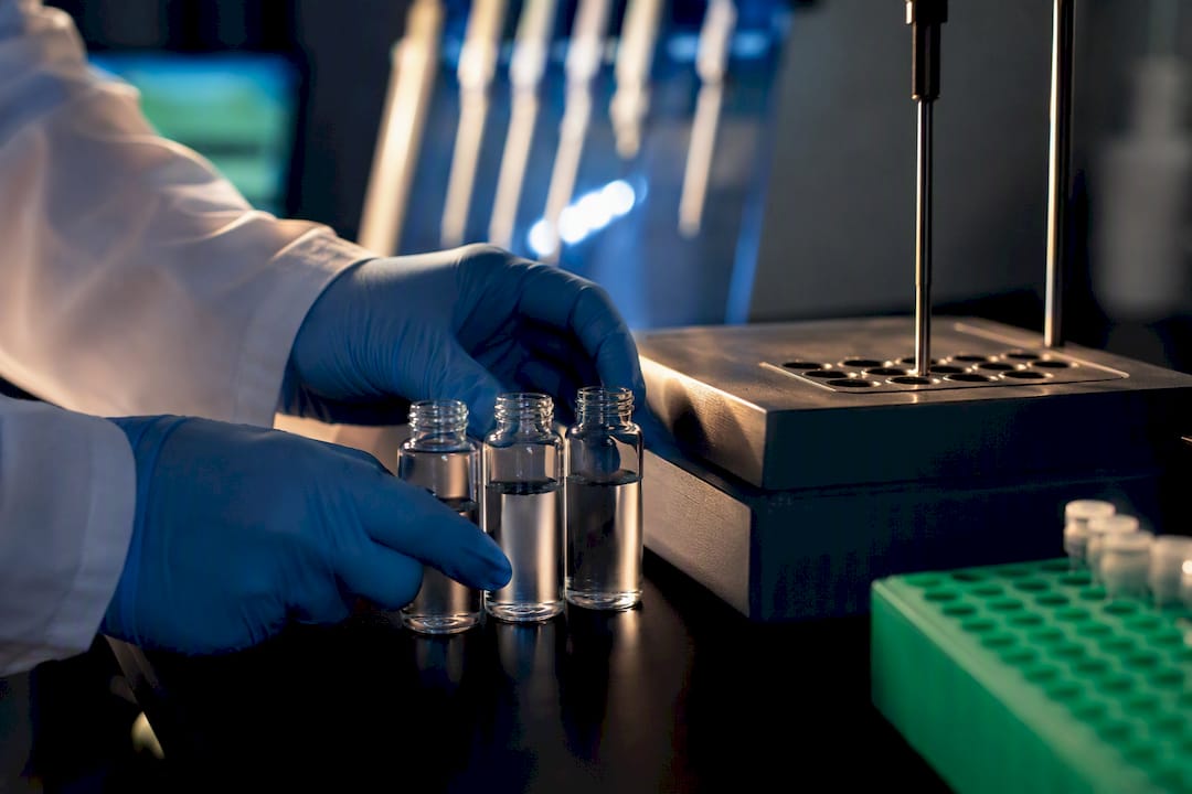 Anonymous vials beside laboratory temperature block